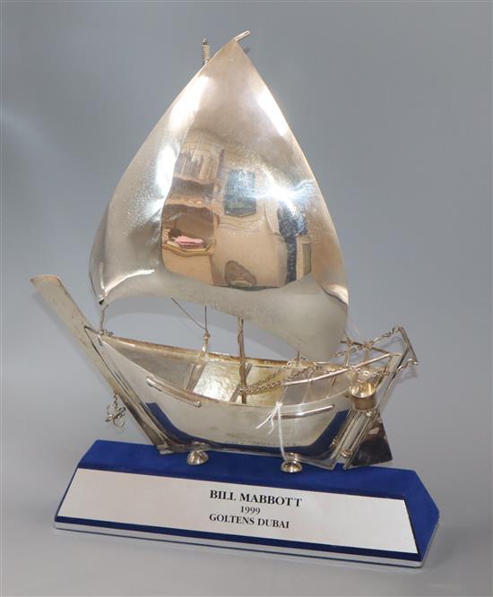 A 925 white metal model of a boat, cased, approx. 32cm.
